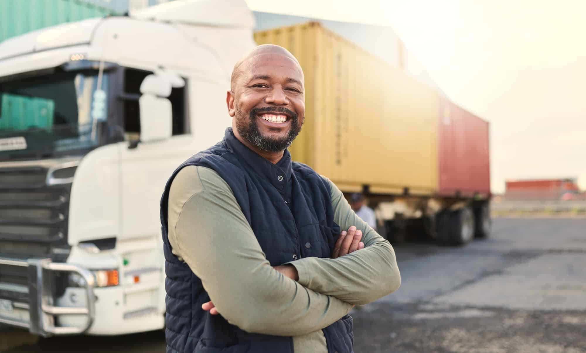 Delivery, container and happy truck driver moving industry cargo and freight at a shipping supply center