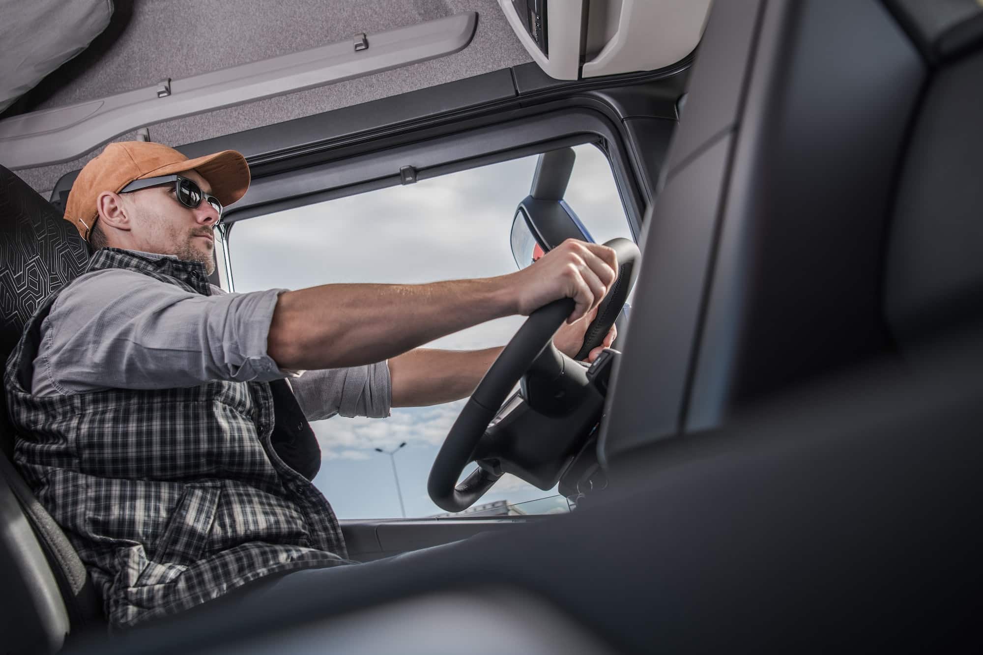 A commercial truck driver behind the wheel